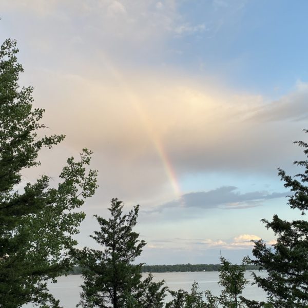 Rainbow in the sky over the lake