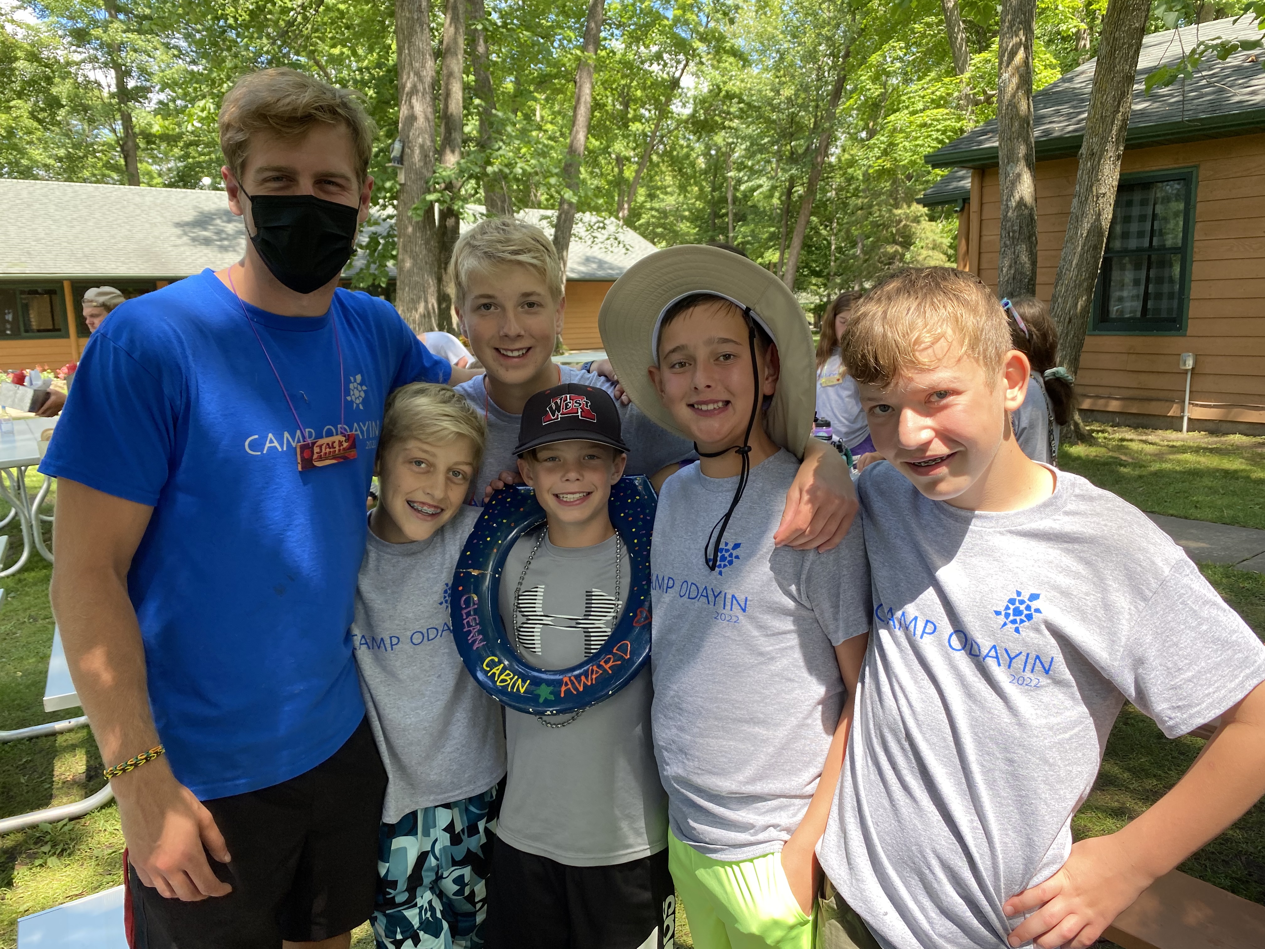 Volunteer counselor with five campers at MN Residential Camp