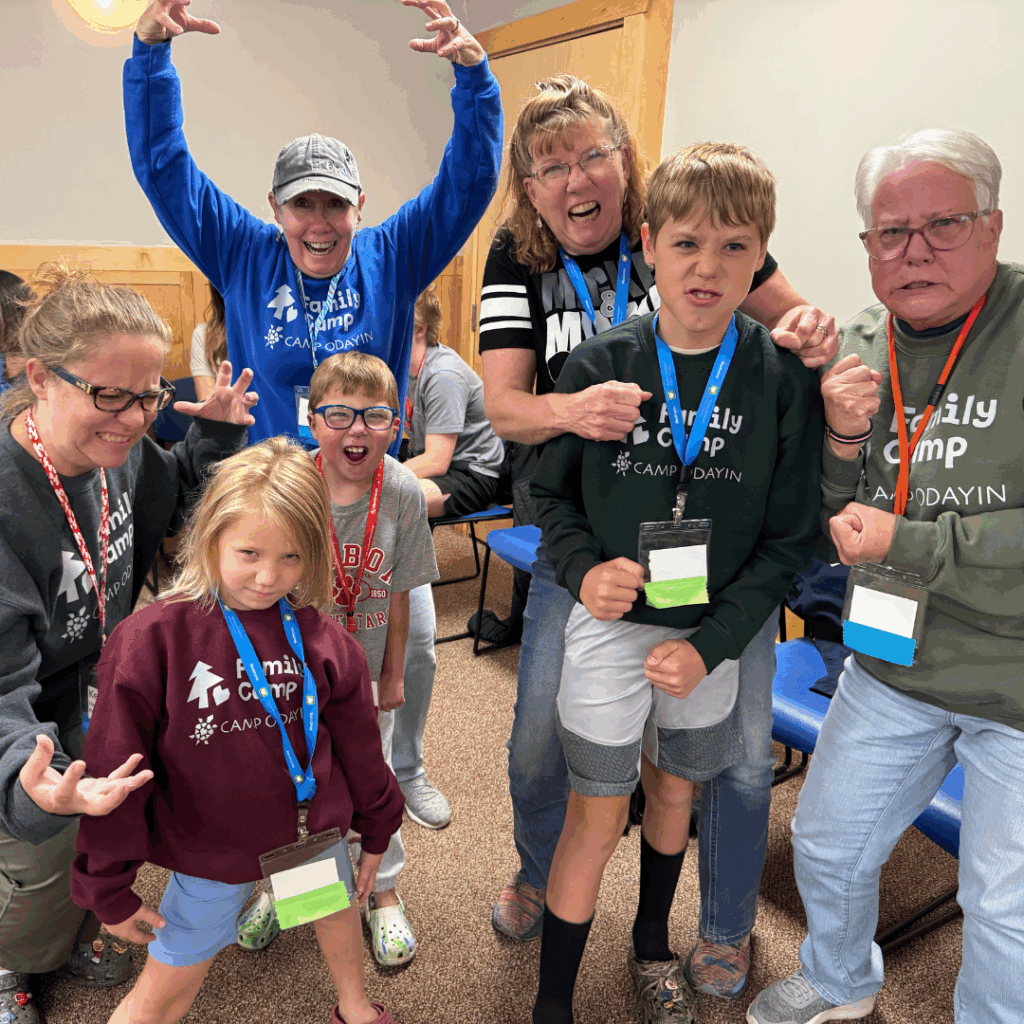 Members of multi-generational families make faces at the camera