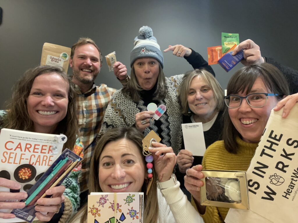 The Odayin team holding up the contents of the 2025 gift box