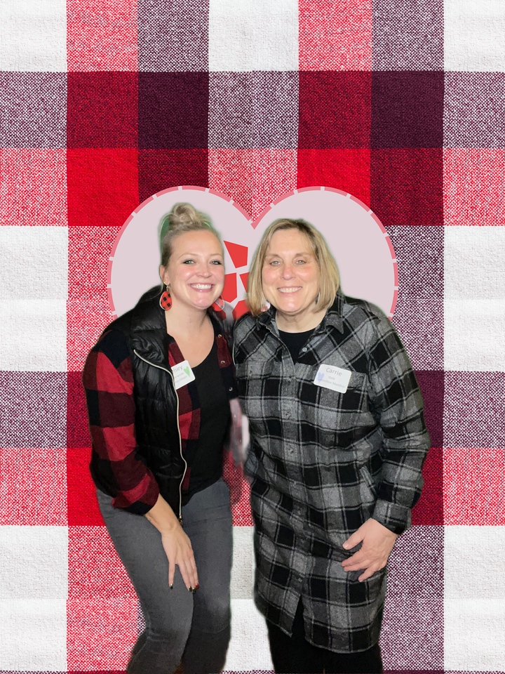 Wisconsin Camp Directors Kelsey and Carrie pose at the Flannels & Friends photobooth