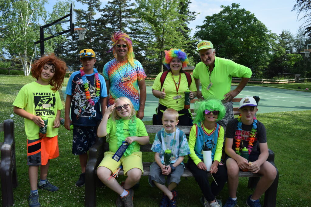 A group of campers dressed in bright colors