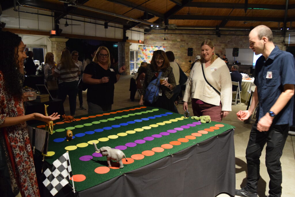 Guests playing a large animal racing game