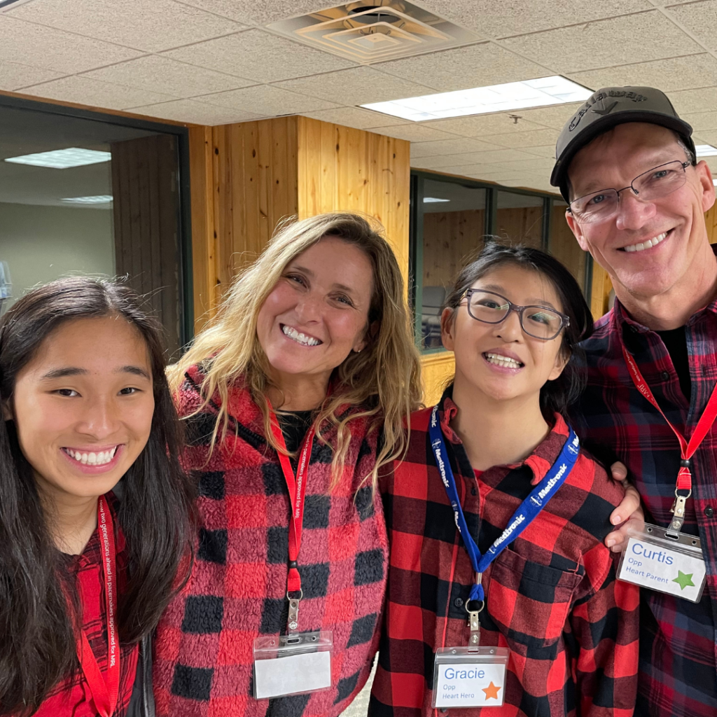 Family dressed in matching red and black plaid