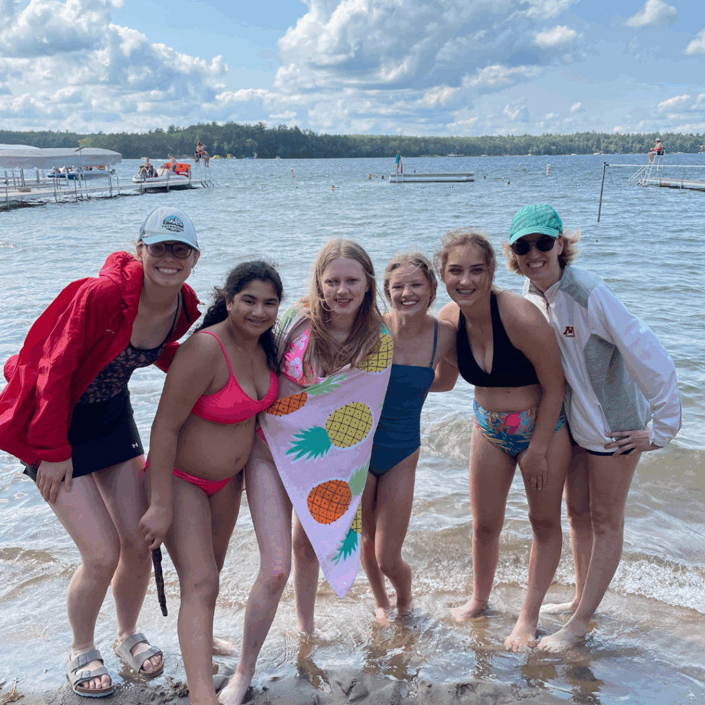Campers and volunteers in swimsuits at the lake