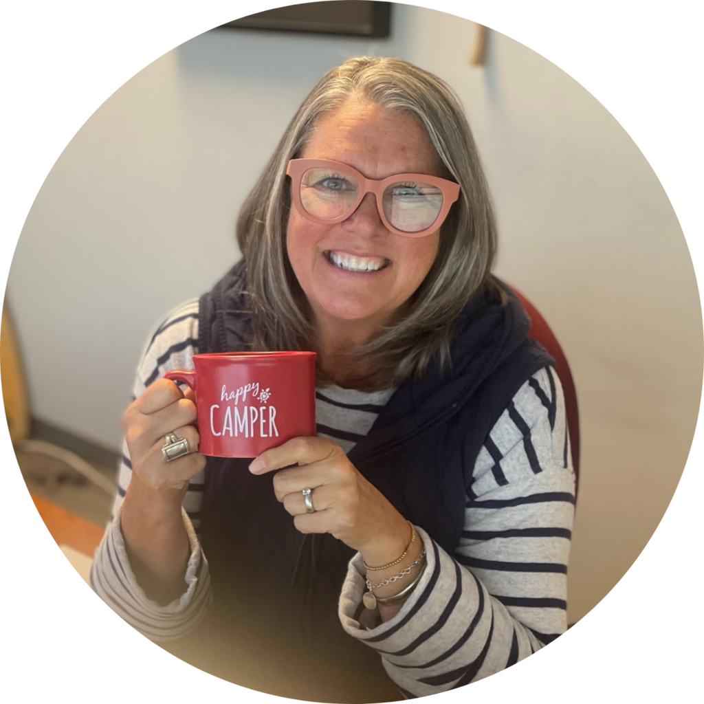 Sara holding a red mug